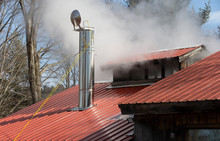 Steam Coming From Stack On Maple Sugar House In Vermont