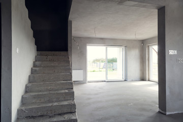 Interior of the building in the developer state. Finishing rooms.