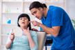 © Elnur - Old woman visiting male doctor for plastic surgery