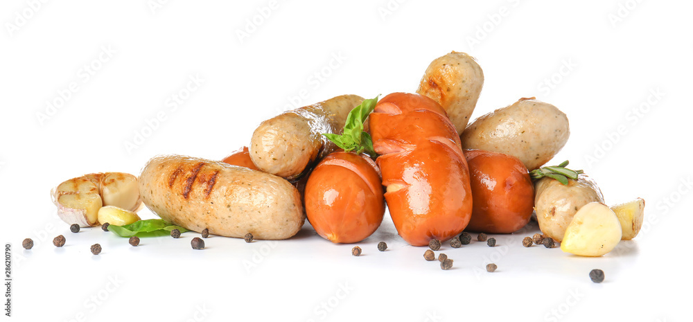 Tasty grilled sausages on white background