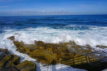 waves crashing on rocks