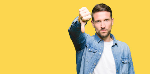 Sticker - Handsome man with blue eyes and beard wearing denim jacket looking unhappy and angry showing rejection and negative with thumbs down gesture. Bad expression.