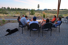 Six Friends Around A Fire Pit Enjoy Afternoon View Of Landscape Around Sisters, Oregon On A Perfect Summer Afternoon.