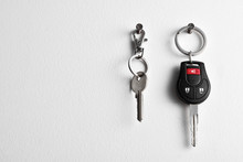 Car And House Keys Hanging On Wall