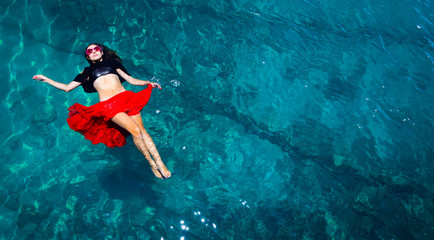 Aerial view of a woman in the sea