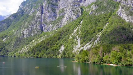 Wall Mural - Kayaking in Lake Bohinj, Slovenia, Top down aerial footage.