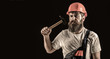 Bearded builder isolated on black background. Bearded man worker with beard, building helmet, hard hat. Hammer hammering. Builder in helmet, hammer, handyman, builders in hardhat. Copy space