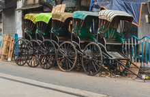  Hand-pulled Rickshaw Parked At The Roadside.  