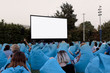 Audience waiting for movie screening in open air cinema
