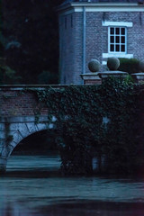 Wall Mural - Ancient bridge of country house at dusk.