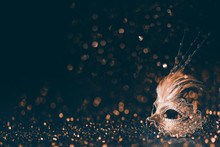 Luxury Venetian Mask On Dark Godlen Bokeh Background. New Year And Christmas Party Celebration Design Banner.