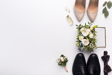 wedding shoes and accessories on white background