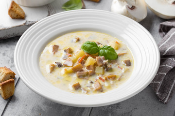 Canvas Print - Cheese soup with mushrooms, potatoes, carrots and croutons Delicious cozy first course, autumn food