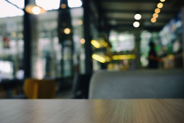 Close up Surface of Wooden Table in Cafe with Bokeh Background. (Selective Focus)