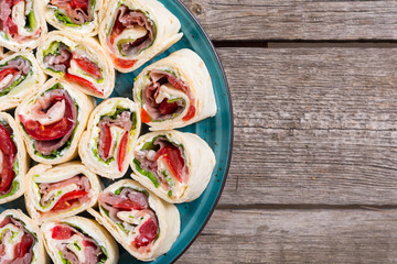 Sliced sandwich tortilla with vegetables and ham