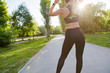 © fotofabrika - Sporty young woman in sportswear running in the park in the morning