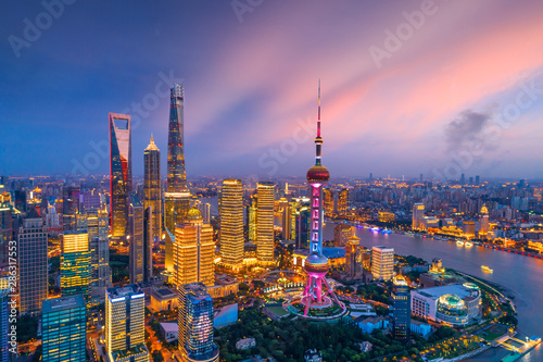 Fotomural Aerial view of Shanghai skyline at night,China.