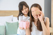 © Pixel-Shot - Little girl greeting her mother in bedroom