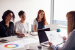 © Monkey Business - Team Of Young Businesswomen In Meeting Around Table In Modern Workspace