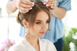 © Pixel-Shot - Professional hairdresser working with young bride at home