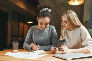 Succeeding together. Businesswomen have a meeting in a modern cafe