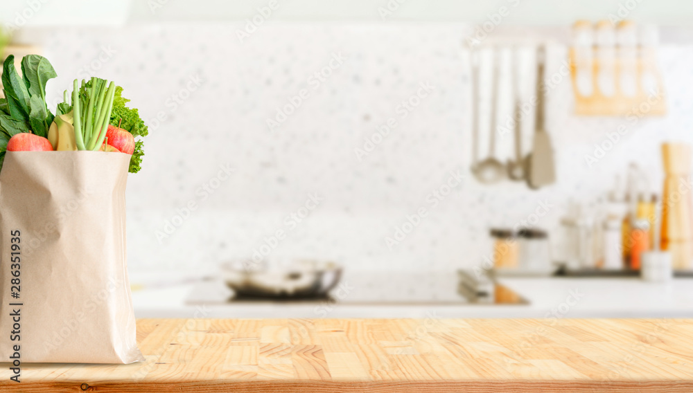 Wood table top on blurred kitchen background - obrazy, fototapety, plakaty 
