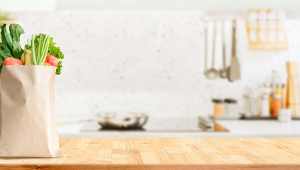 Wood table top on blurred kitchen background