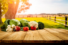 Table Background With Fresh Vegetables And Sunny Autumn View. 