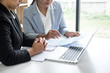 © Ngampol - Businesswoman leader team conference on meeting presentation to planning investment project working and strategy of business making conversation with partner, financial and accounting concept