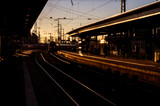 Fototapeta Pomosty - Train arrives to the station at the evening