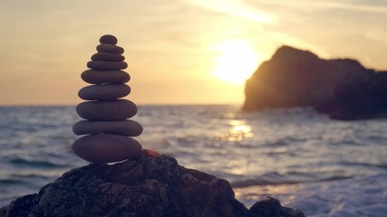 Wall Mural - Concept of balance and harmony - stone stacks on the beach