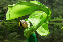 Dancer In Green Dress With Very Long Sleeves In Connecticut Woods.
