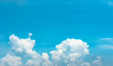 Beautiful Blue Sky And White Cumulus Clouds Abstract Background. Cloudscape Background. Blue Sky And Fluffy White Clouds On Sunny Day. Nature Weather. Bright Day Sky For Happy Day Background.