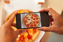 Taking Photo Of Pizza Dinner With Mobile Phone.