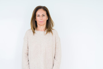 Wall Mural - beautiful middle age woman over isolated background relaxed with serious expression on face. simple 