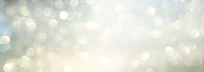 background of abstract glitter lights. silver and gold. de-focused. banner