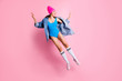 Full body photo of funky youngster making v-signs wearing blue body suit white knee-socks isolated over pink background