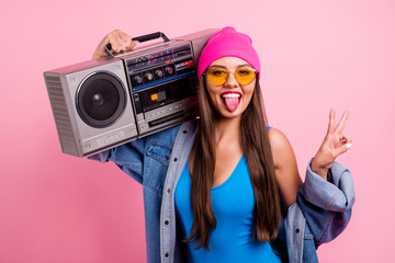 Sticker - Close-up portrait of nice attractive glamorous cheerful cheery positive comic childish playful straight-haired girl carrying boombox showing v-sign isolated over pink pastel background