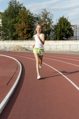 Front view of girl on running track