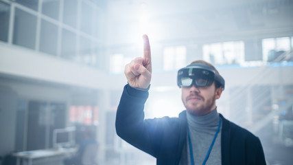 Poster - Automotive Engineer Using Augmented Reality Headset and Making Touching Gestures of Virtual Objects in the Air. In Innovation High Tech Laboratory Facility with Futuristic Atmosphere.