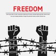 © natbasil - Fighting for freedom concept. Hands clenched into fist behind barbed wire