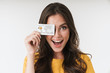 © Drobot Dean - Image of gorgeous brunette woman wearing casual clothes smiling and holding credit card