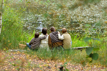 Wall Mural - Portrait of family of four in park