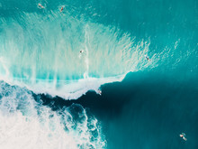 Aerial View Of Surfing At Barrel Waves. Blue Wave In Ocean And Surfers