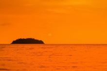 View Of Small Island With Orange Sea And Sky Background, Sunset At Kai Bae Beach, Koh Chang Island, Trat, Thailand.