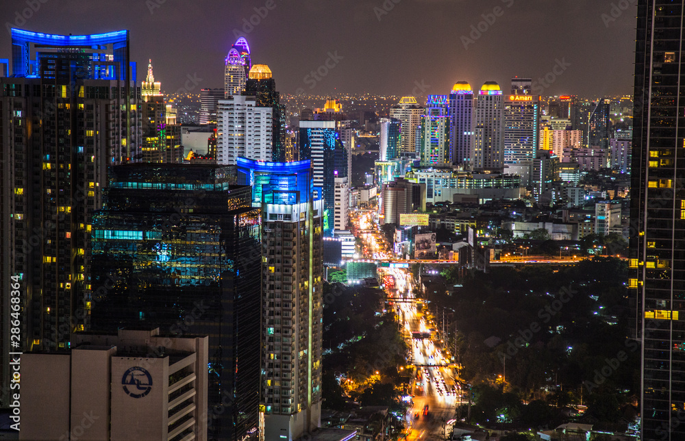 Bangkok street views by night in Thailand - obrazy, fototapety, plakaty 