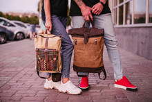 Close Up. Man With Leather Bag And Woman With Textile Backpack. Fashion, Trendy Bags