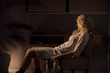 © LUMINA IMAGES - Night portrait of beautiful blonde sensual Caucasian woman sitting on chair at home.