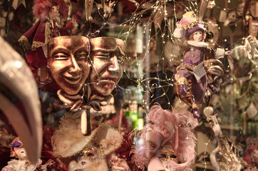  Shop with souvenirs in Venice Carnival masks and dolls behind the window