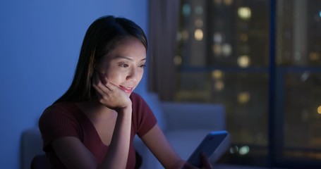 Poster - Woman use of mobile phone at home in the evening